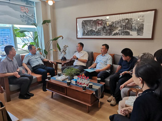 党委统战部部长周东旭一行拜会九...